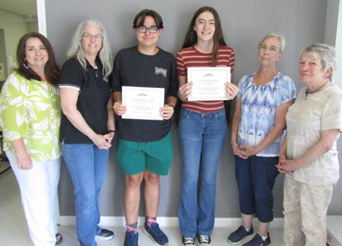 HoH Executive Director Denise Melton, Board Chair Sara Bradshaw, Scholarship recipients Hayden Houston and Cheyenne Davis, HoH Volunteer Vicky Kennedy, and BOD member Zoe Clark. Not pictured is scholarship recipient Bishop Higgins